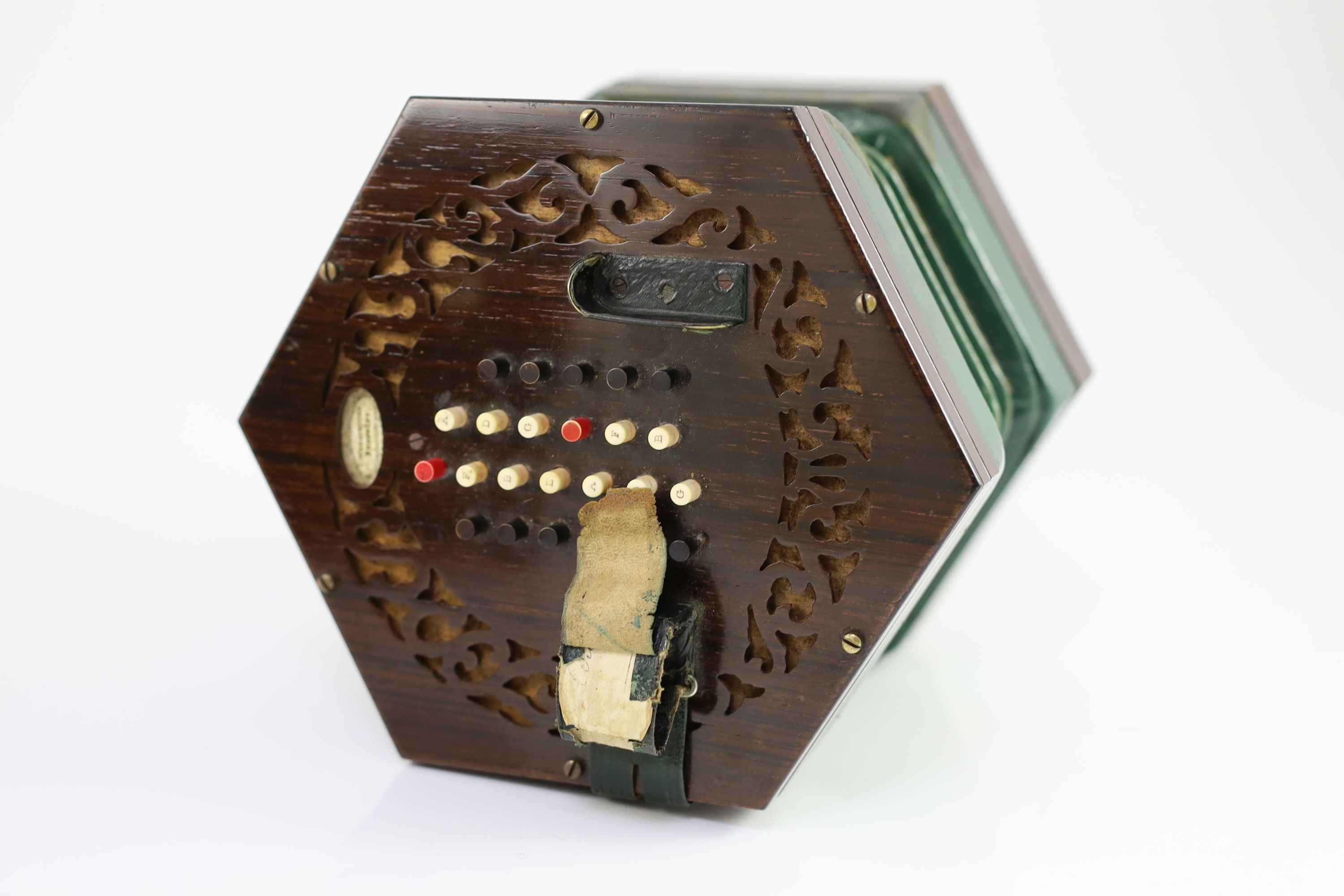 A 48-key C. Wheatstone English model rosewood concertina, diameter 18cm, housed in the original rosewood case
